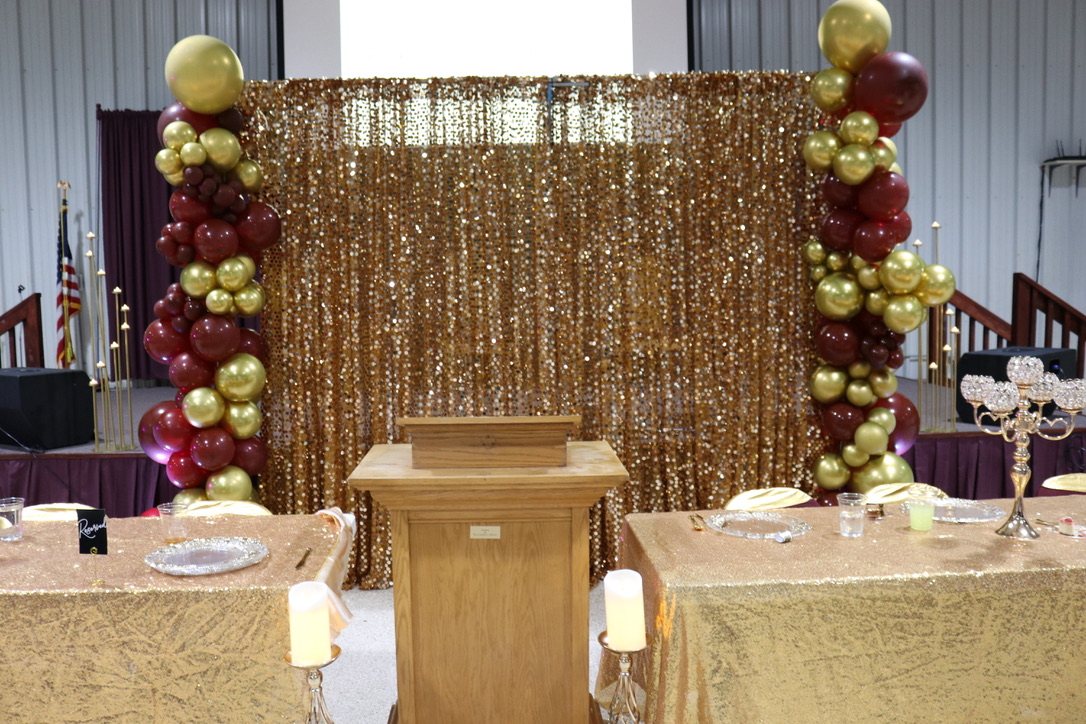 Burgundy and gold event backdrop